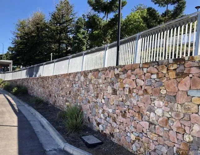 Natural stone retaining wall by All Stone & Pave