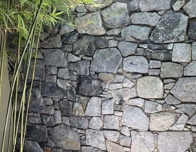 Natural stone retaining wall by All Stone & Pave