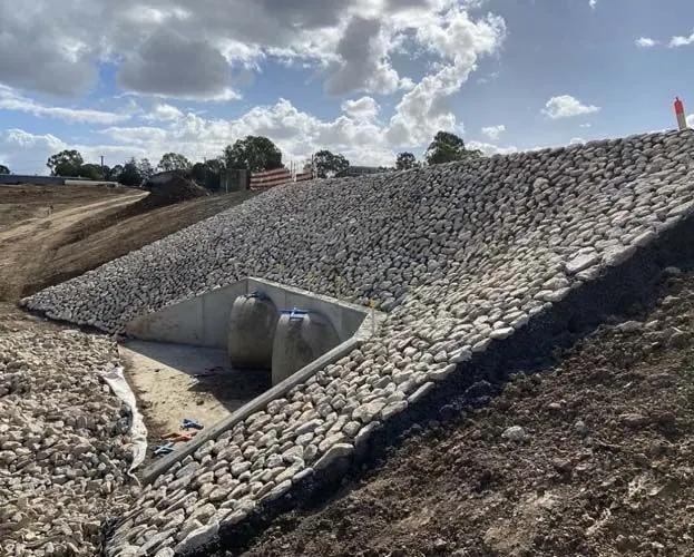 Hand-placed rock pitching by All Stone & Pave