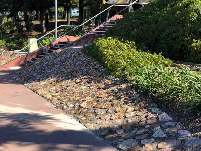 Hand-placed rock pitching by All Stone & Pave