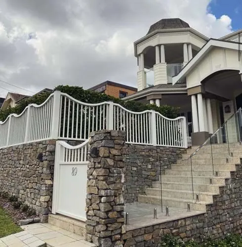 Natural stone retaining wall by All Stone & Pave
