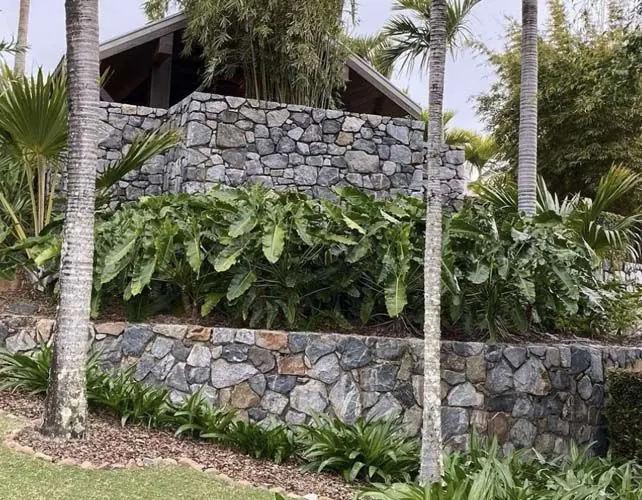 Natural stone retaining wall by All Stone & Pave