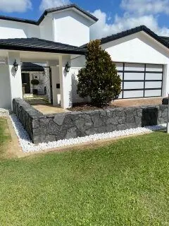 Natural stone retaining wall by All Stone & Pave