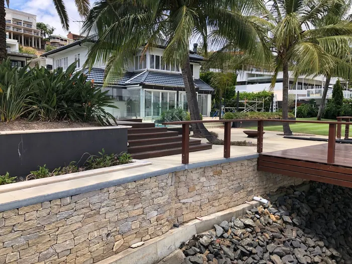 Natural stone retaining wall by All Stone & Pave