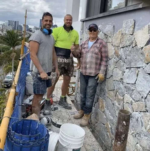 Stonemason carefully restoring natural stonework